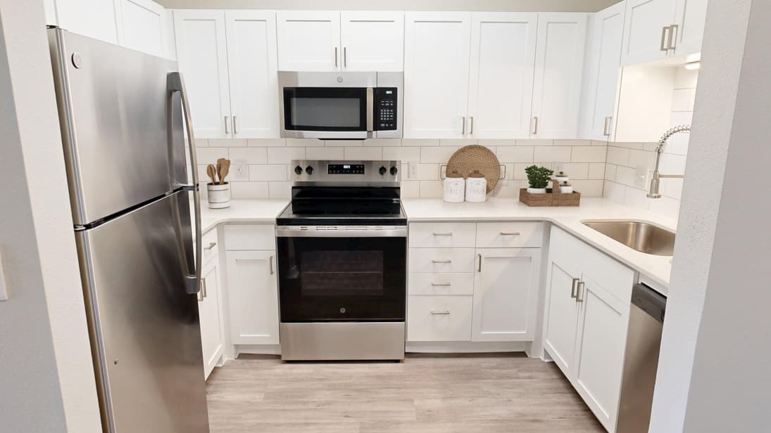 Kenosha apartments for rent - image - MallardCrossing_Carnegie-Renovated_1BD1BA_Kitchen_VirtuallyStaged_2026@3x.jpg