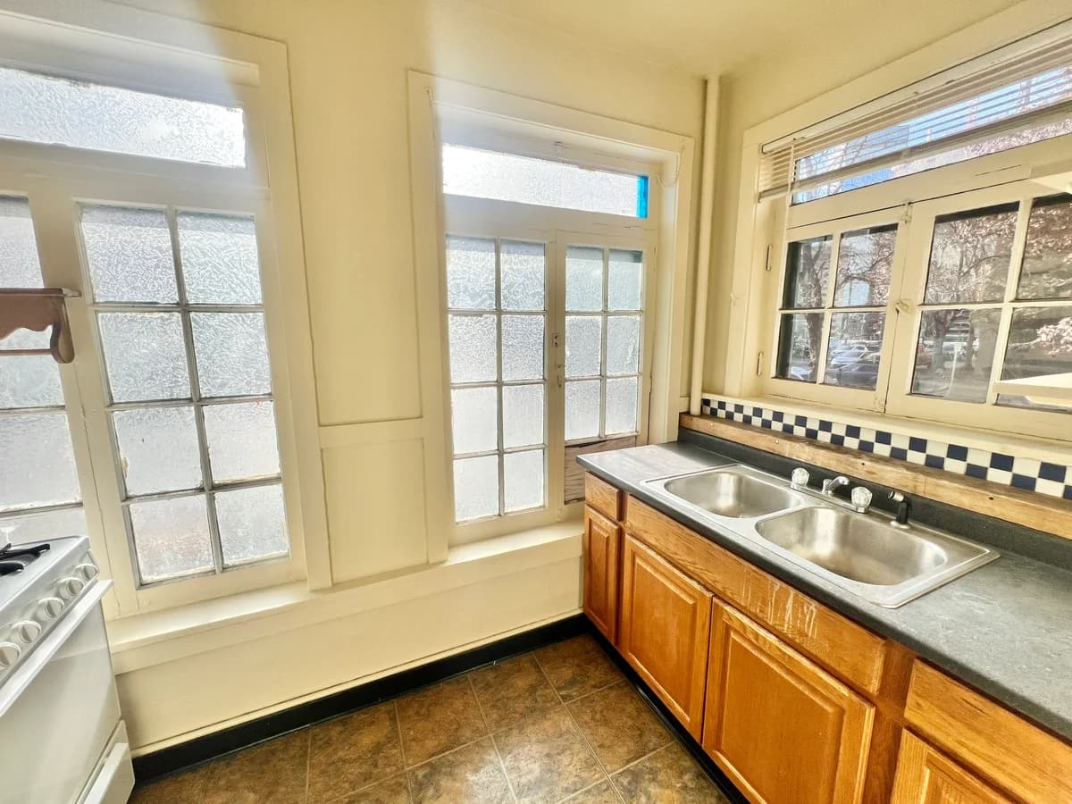 Kenosha apartments for rent - image - Experience the warmth and light in this welcoming kitchen space, perfect for culinary inspiration.